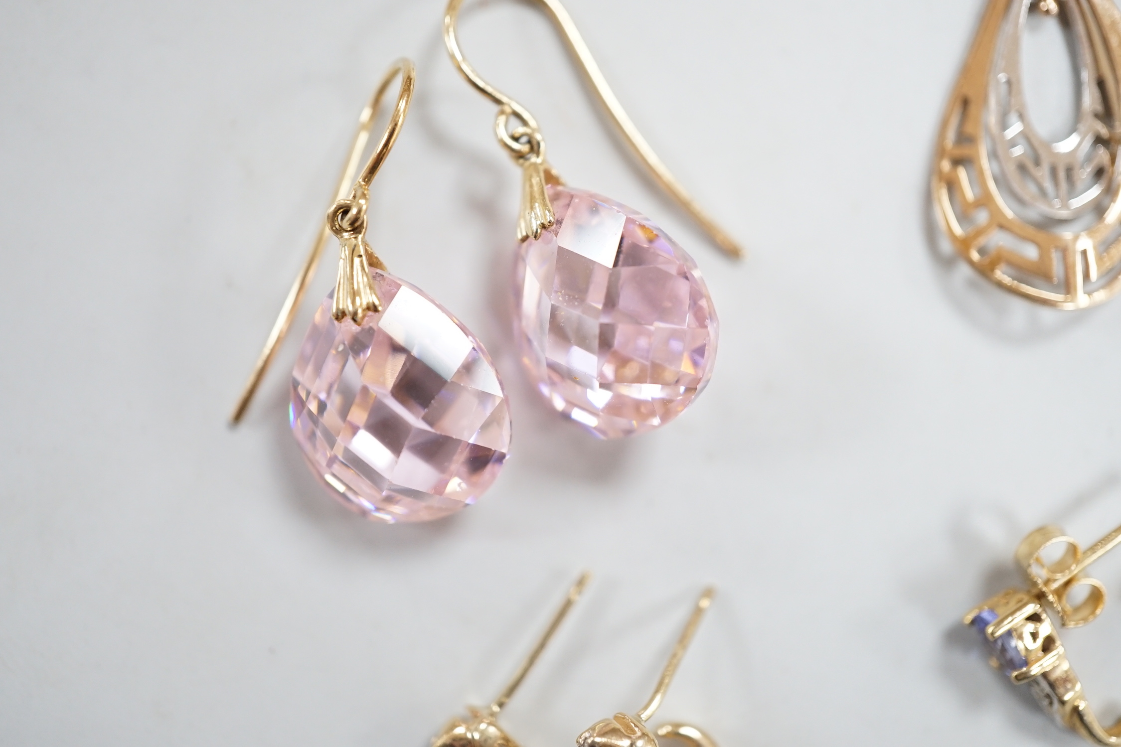 Two modern pairs of 14k drop earrings including pink cubic zirconia, 15mm, gross weight 10.1 grams, two similar pairs of 10k and gem set earrings, gross weight 2.7 grams and a modern pair of yellow metal and opal cluster